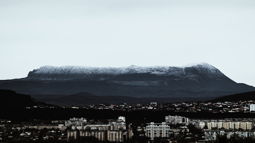 a view of a city with a mountain in the background