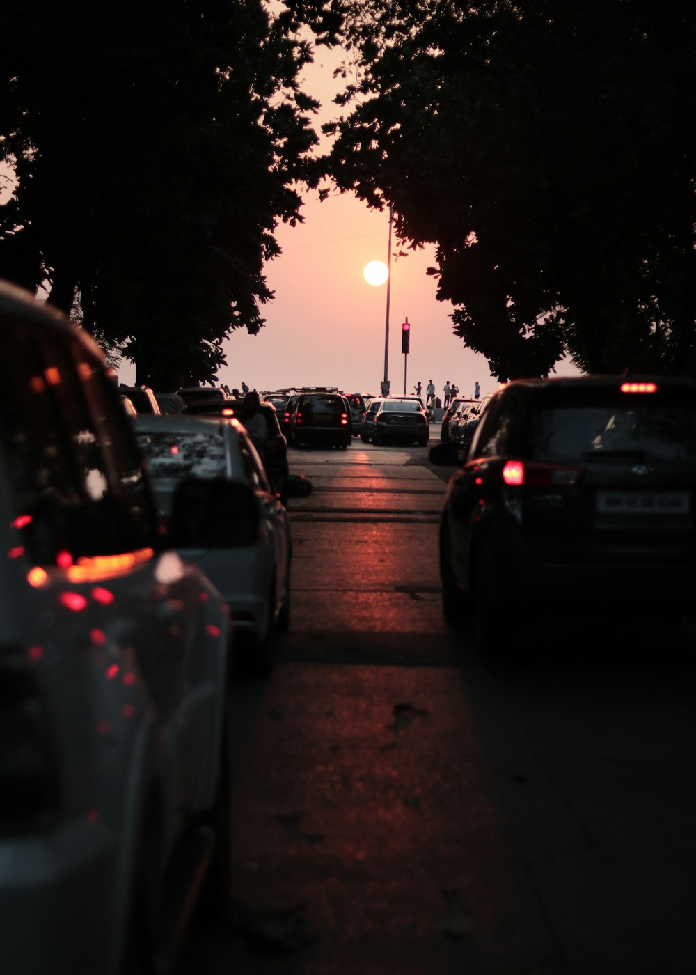 a street filled with lots of traffic next to trees