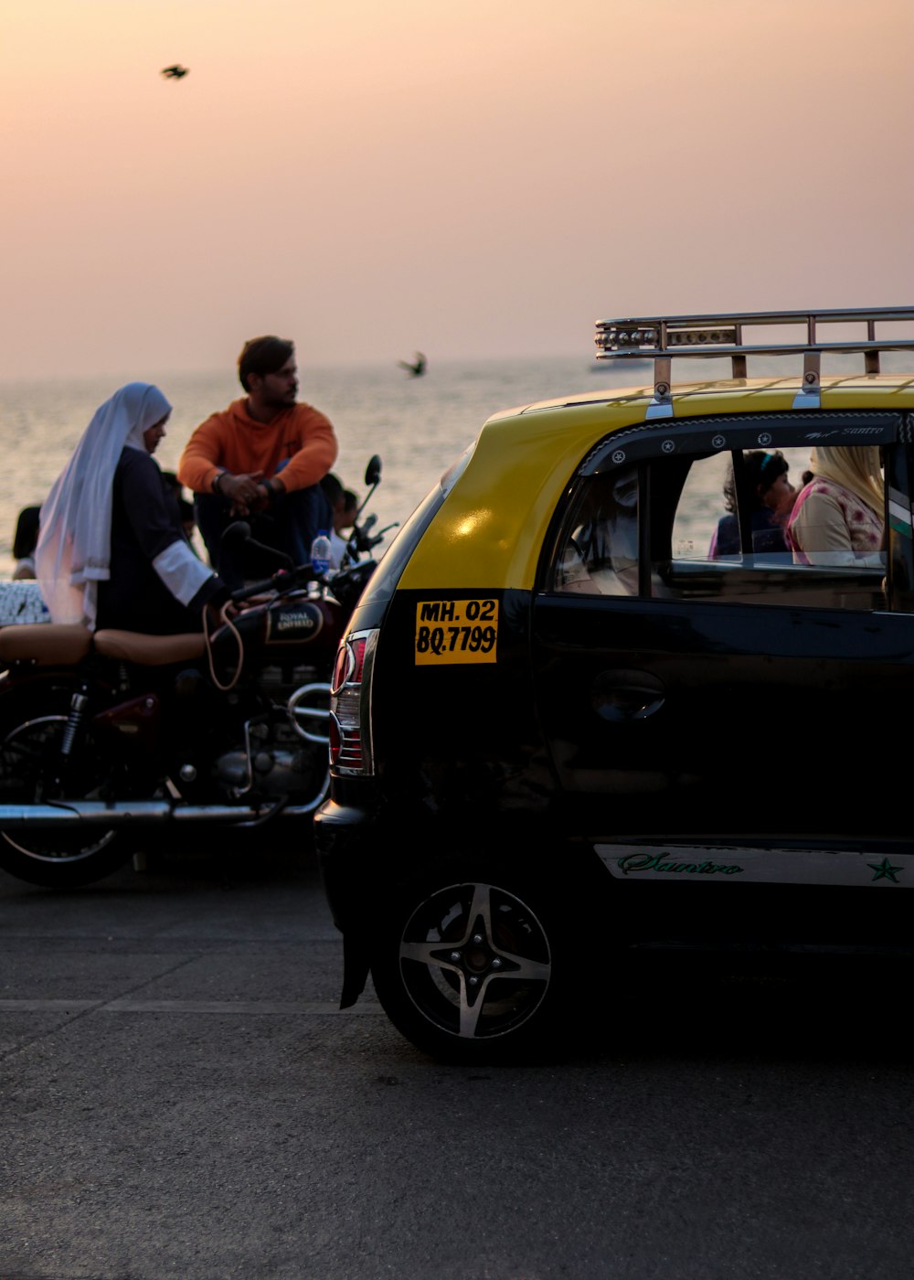 a couple of people that are sitting on a motorcycle