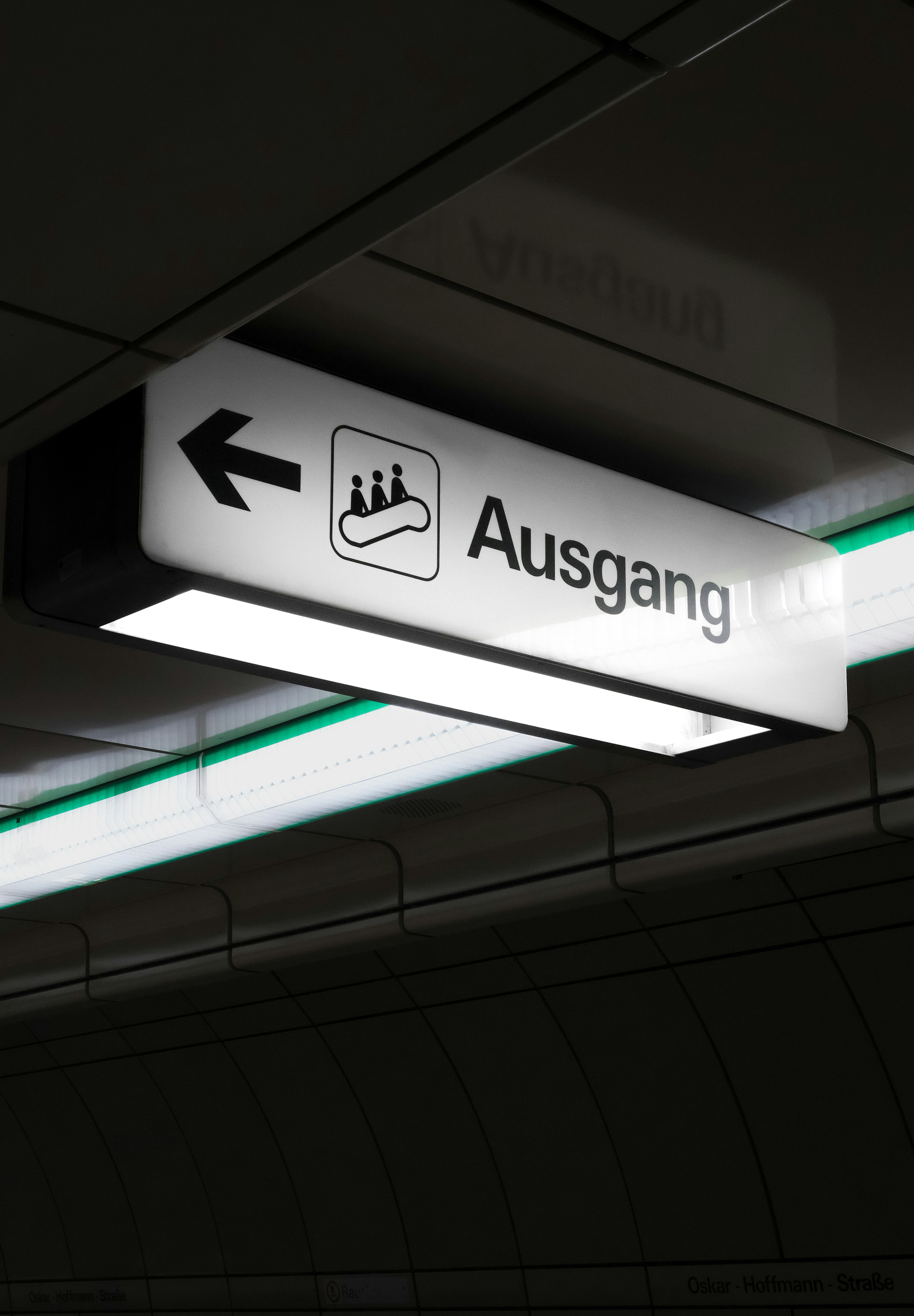 A close up of a sign on a ceiling photo – Free Street photography Image ...