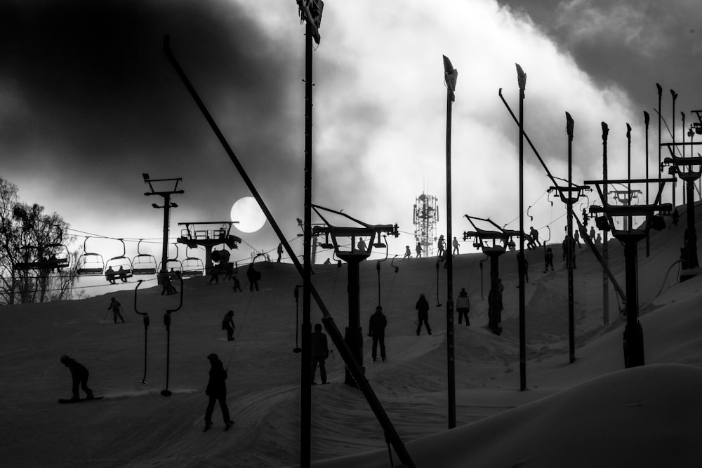 a group of people skiing down a snow covered slope