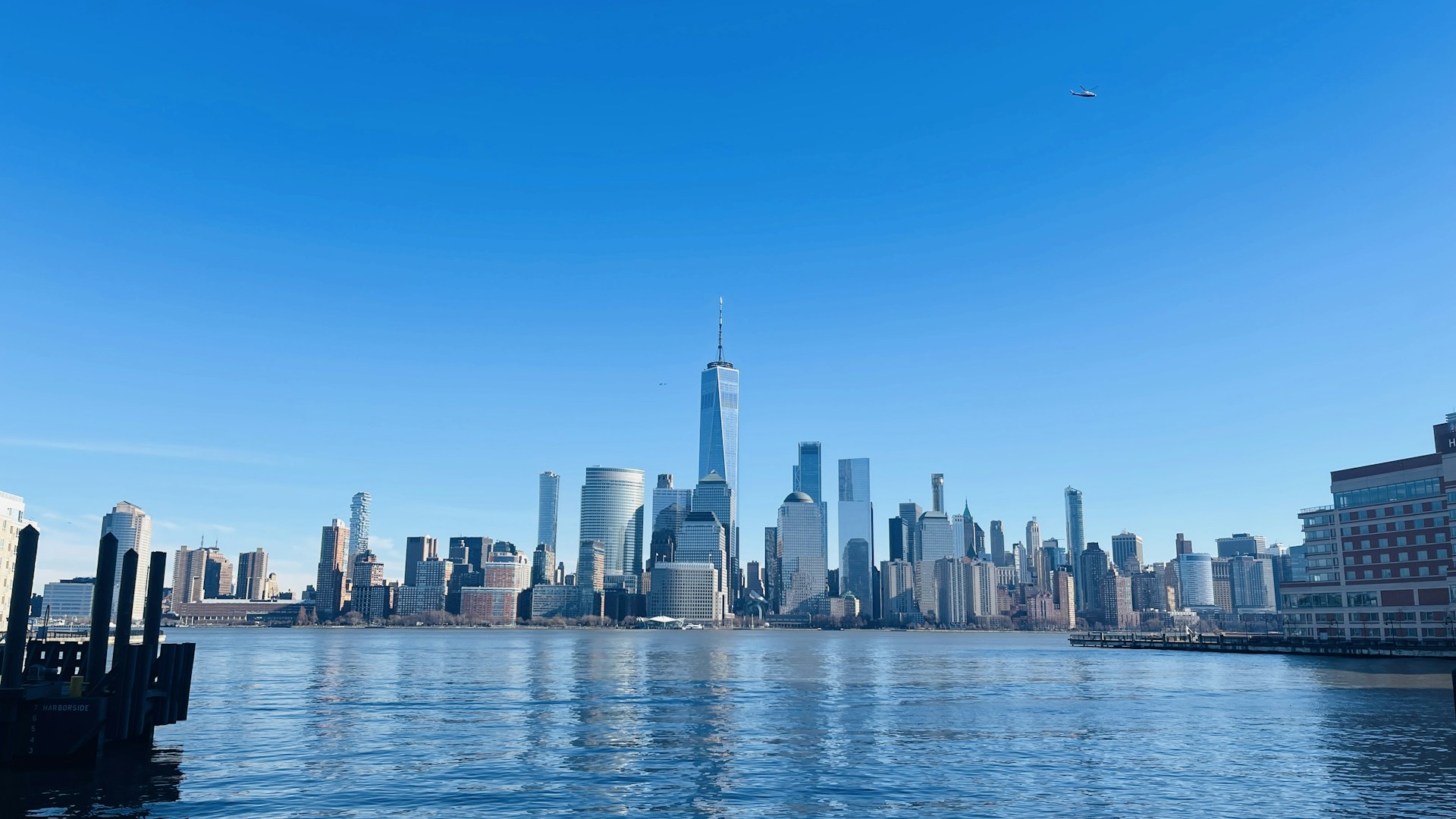 a large body of water with a city in the background