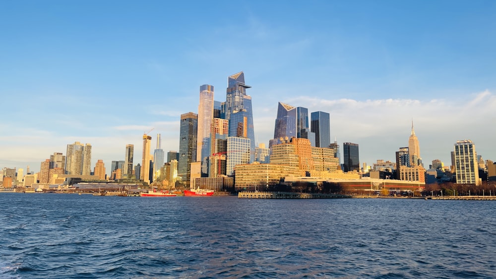 a large body of water with a city in the background