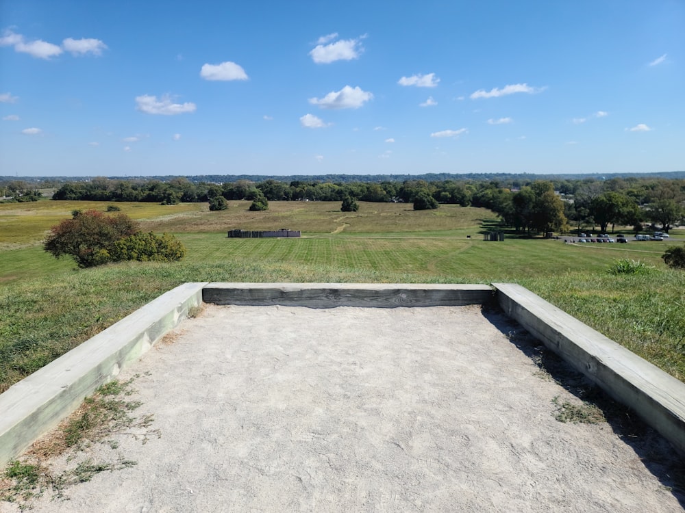 a cement box sitting in the middle of a field