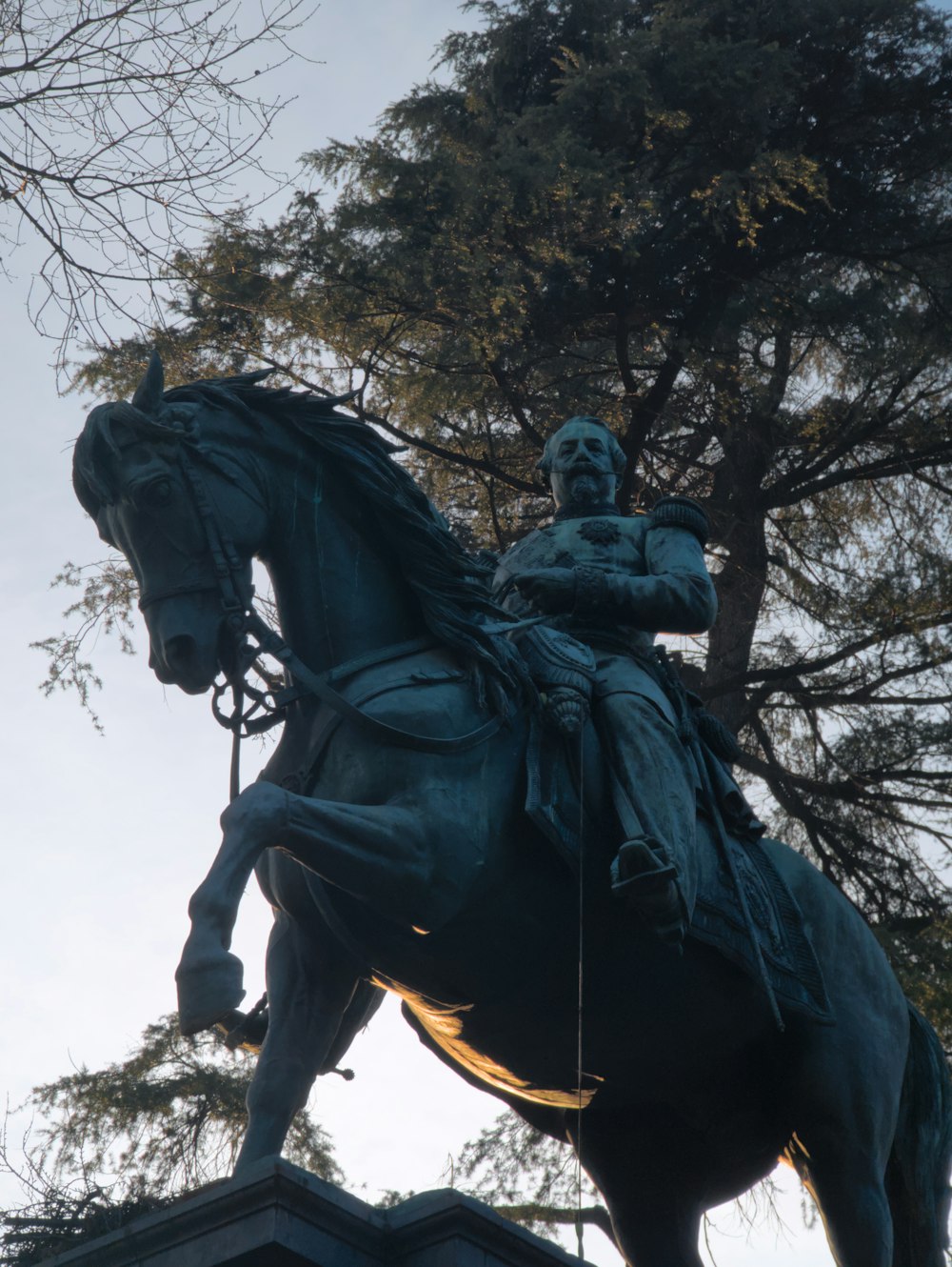 a statue of a man riding on the back of a horse