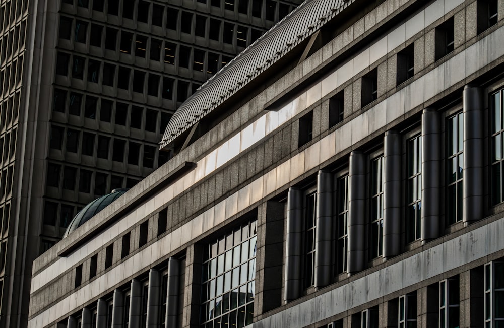 a tall building with many windows in front of it