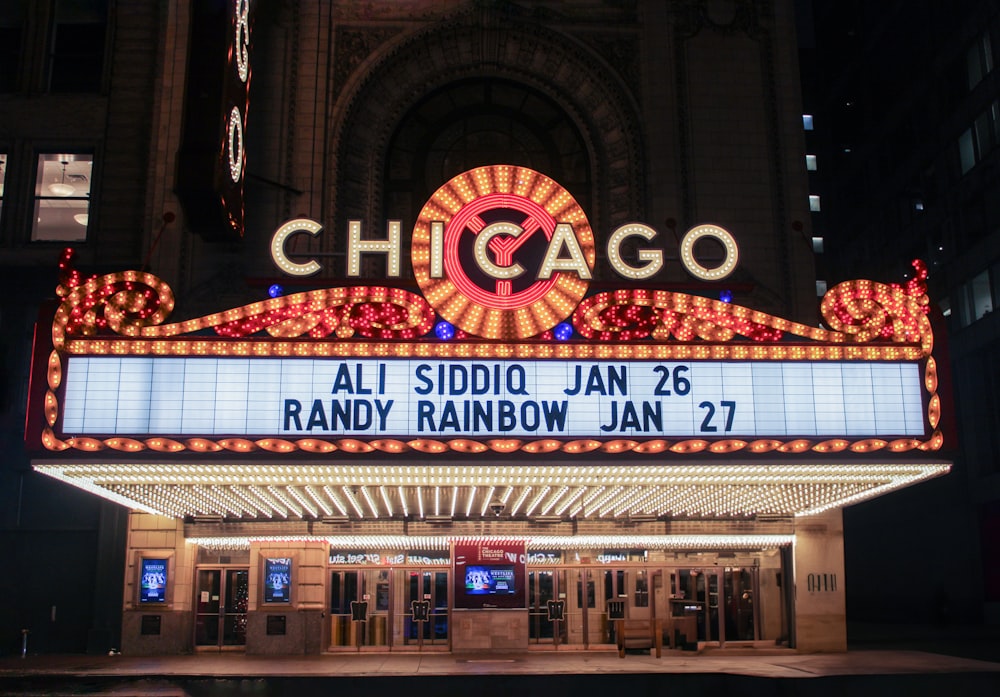 a theater marquee with the chicago sign lit up