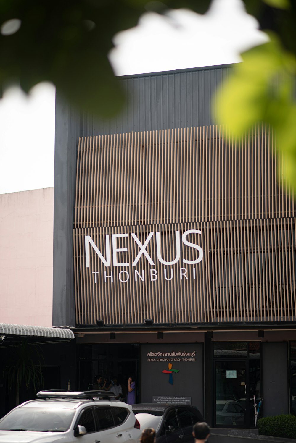 a building with a sign that says nexus house
