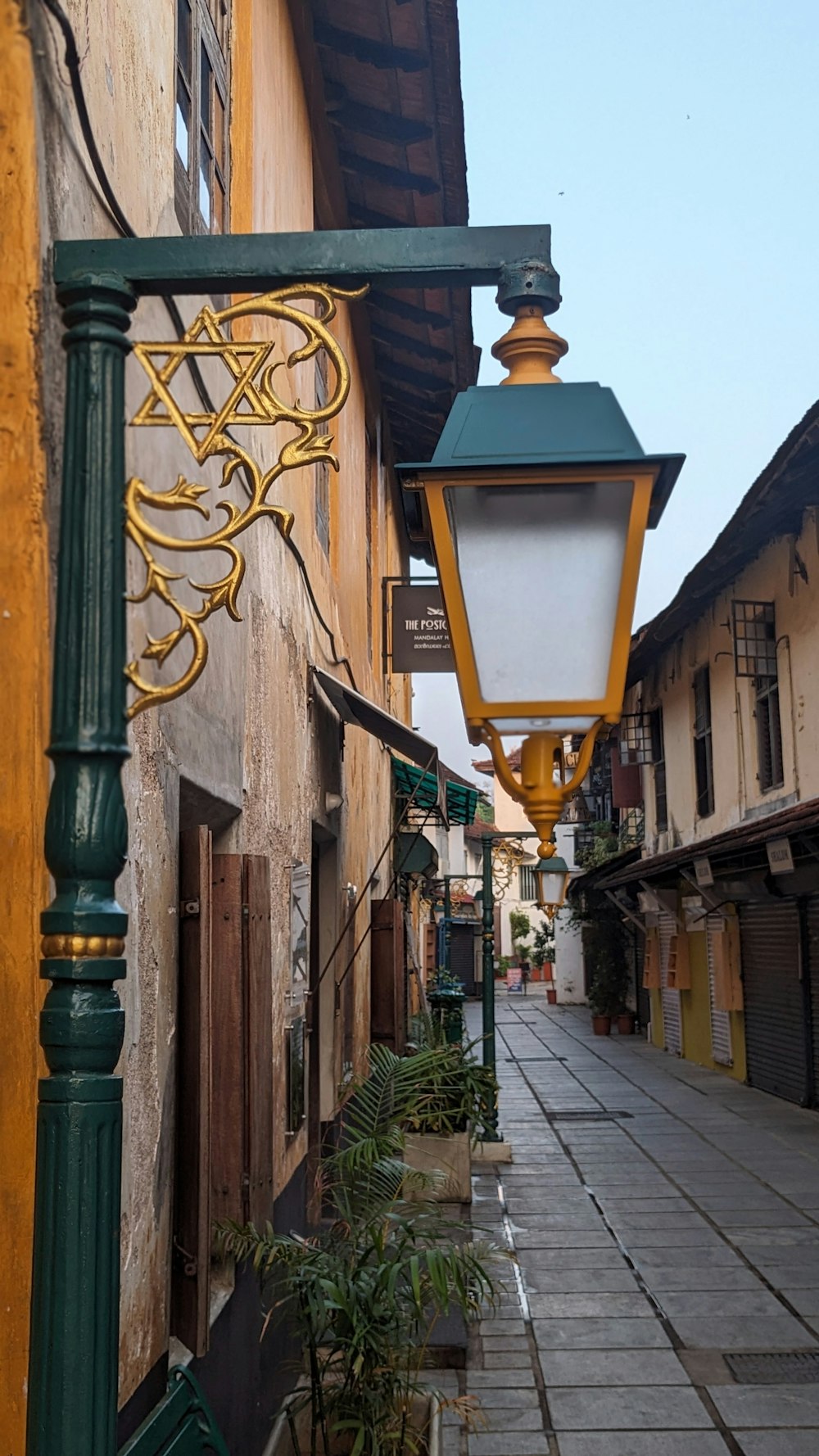 a street light hanging from the side of a building