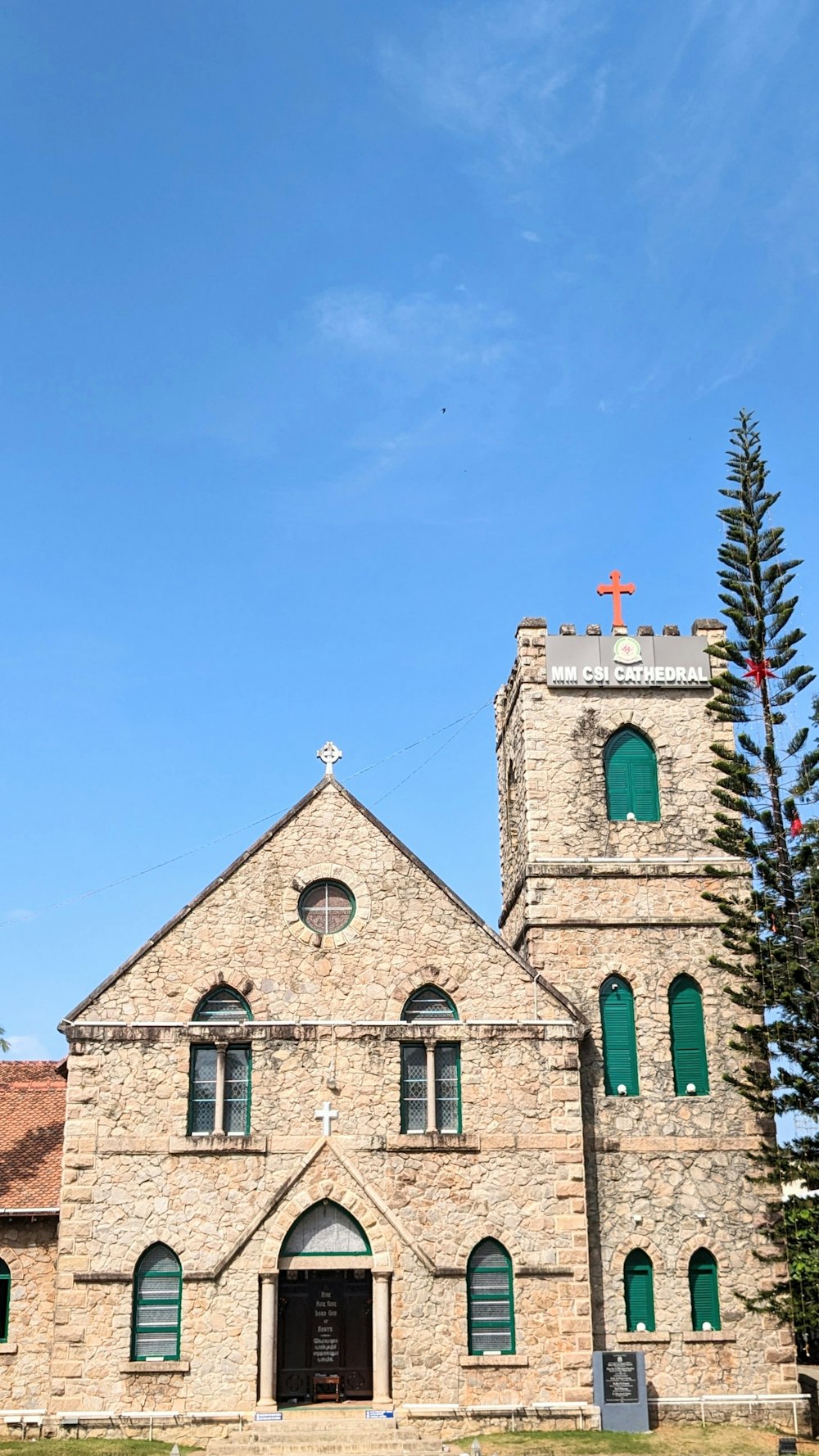 an old church with a cross on the top of it