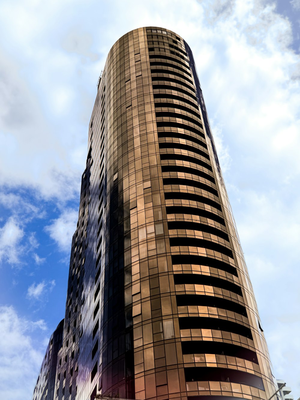 a very tall building with a sky background