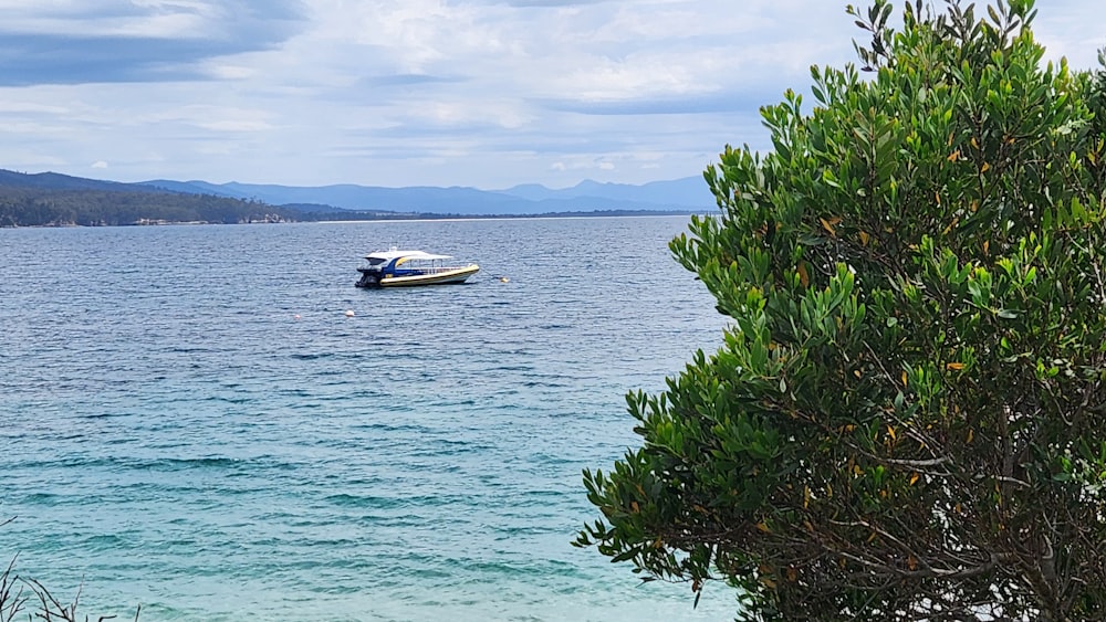 a boat floating on top of a large body of water