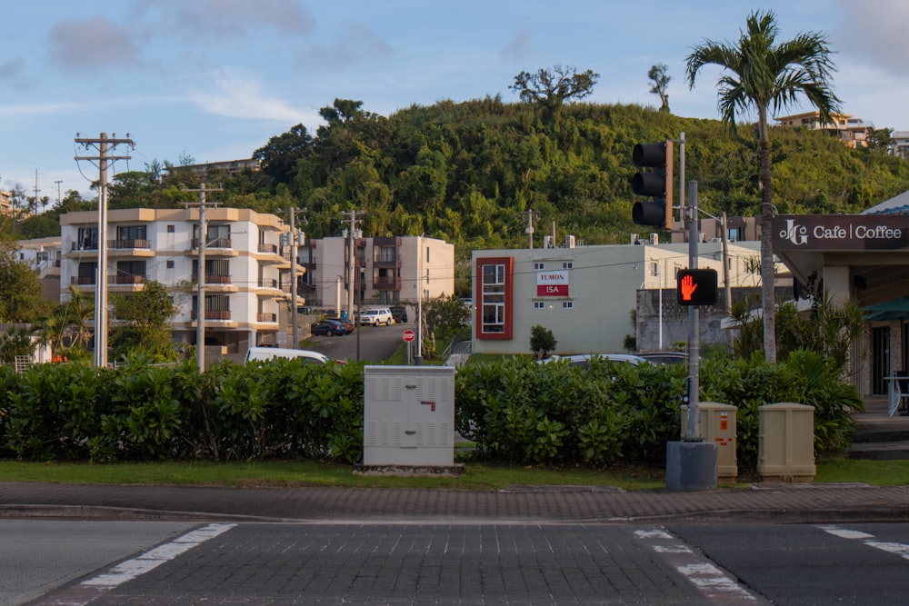 a traffic light sitting on the side of a road