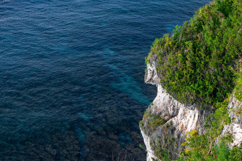 an aerial view of the ocean and cliffs