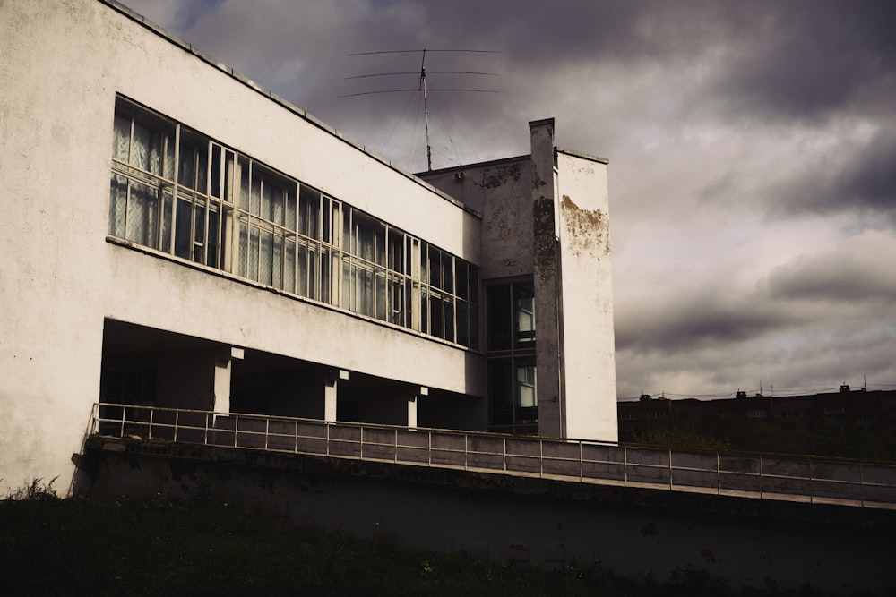 a white building with windows and a balcony