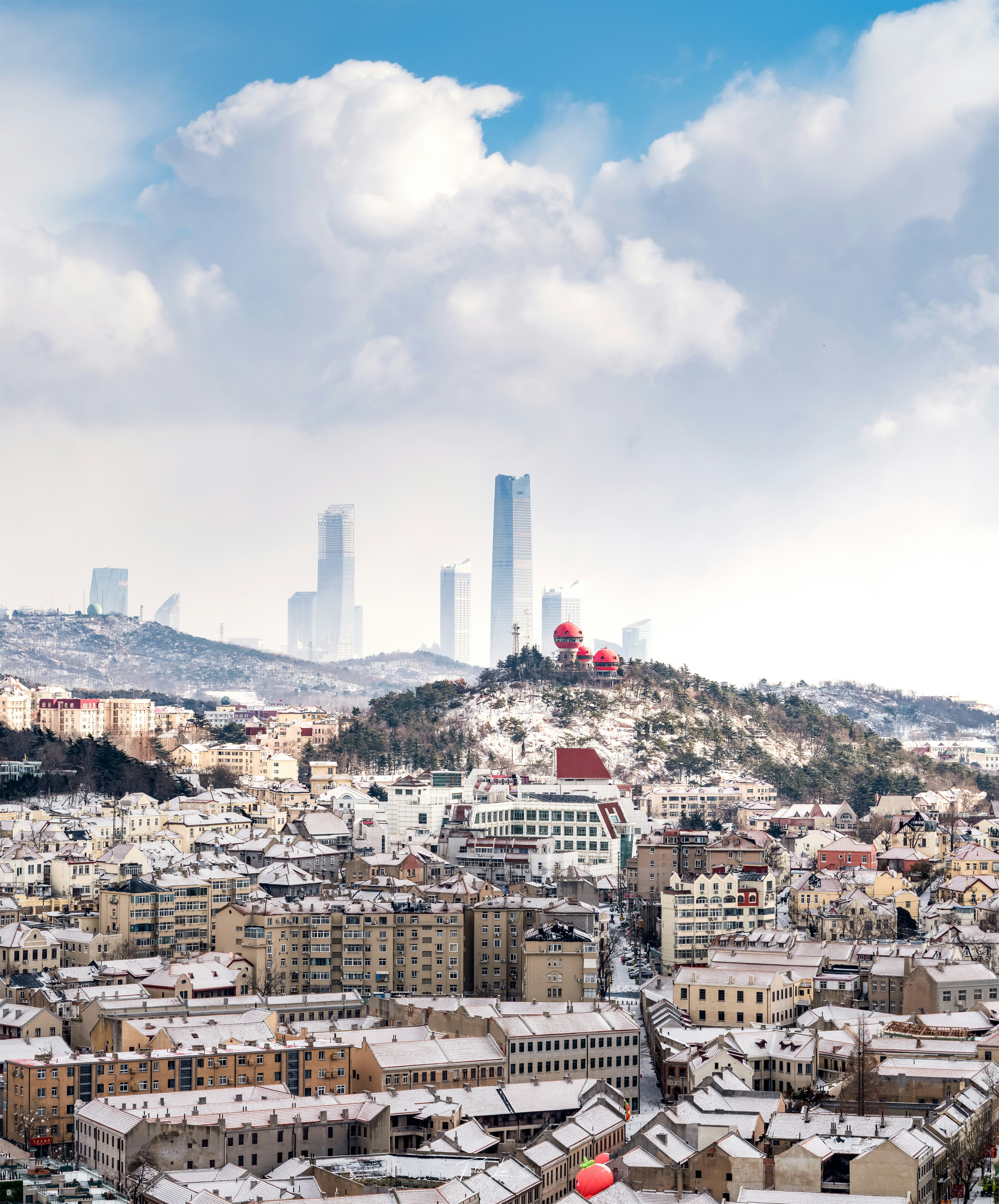 a view of a city from a hill