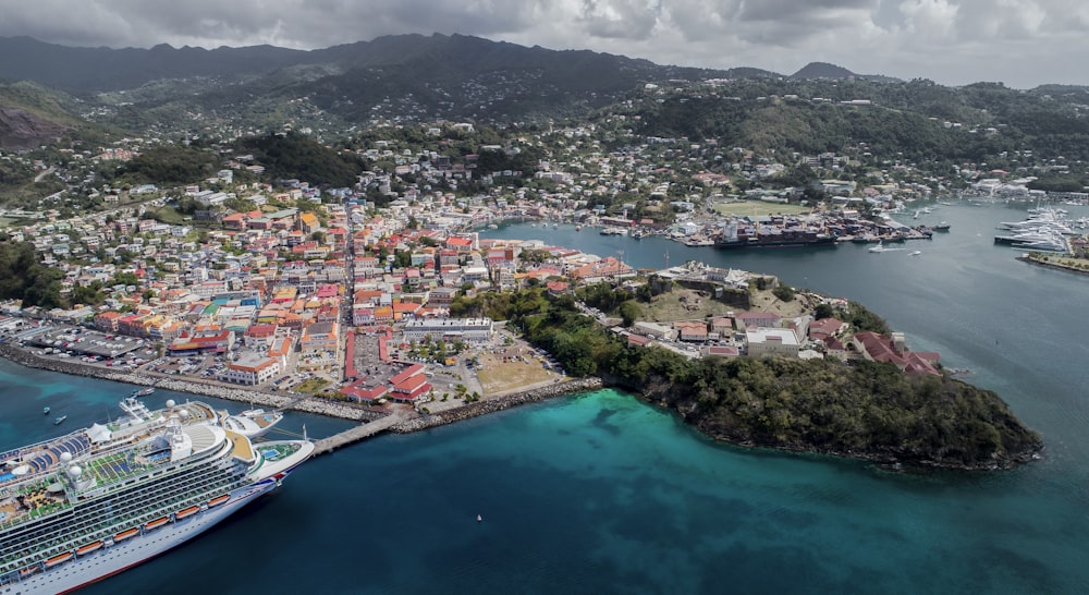 a cruise ship docked in a harbor next to a city