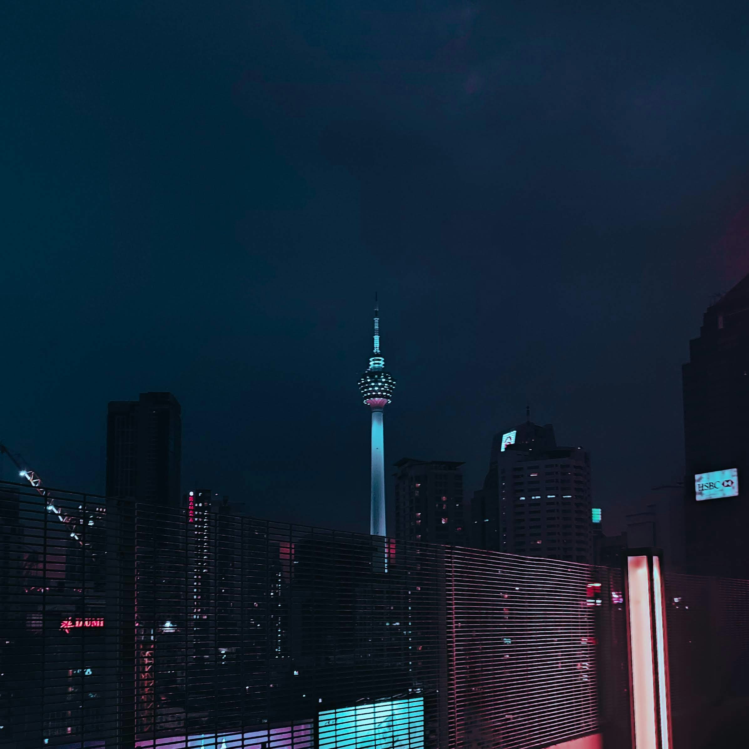 a view of a city at night from a rooftop
