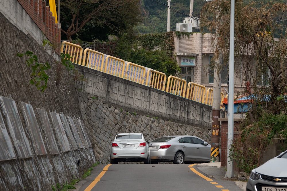 a couple of cars parked on the side of a road