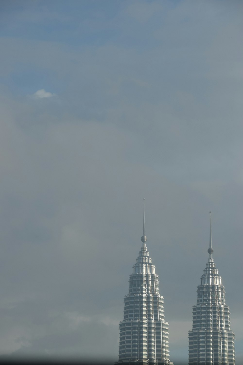 a couple of tall buildings sitting next to each other