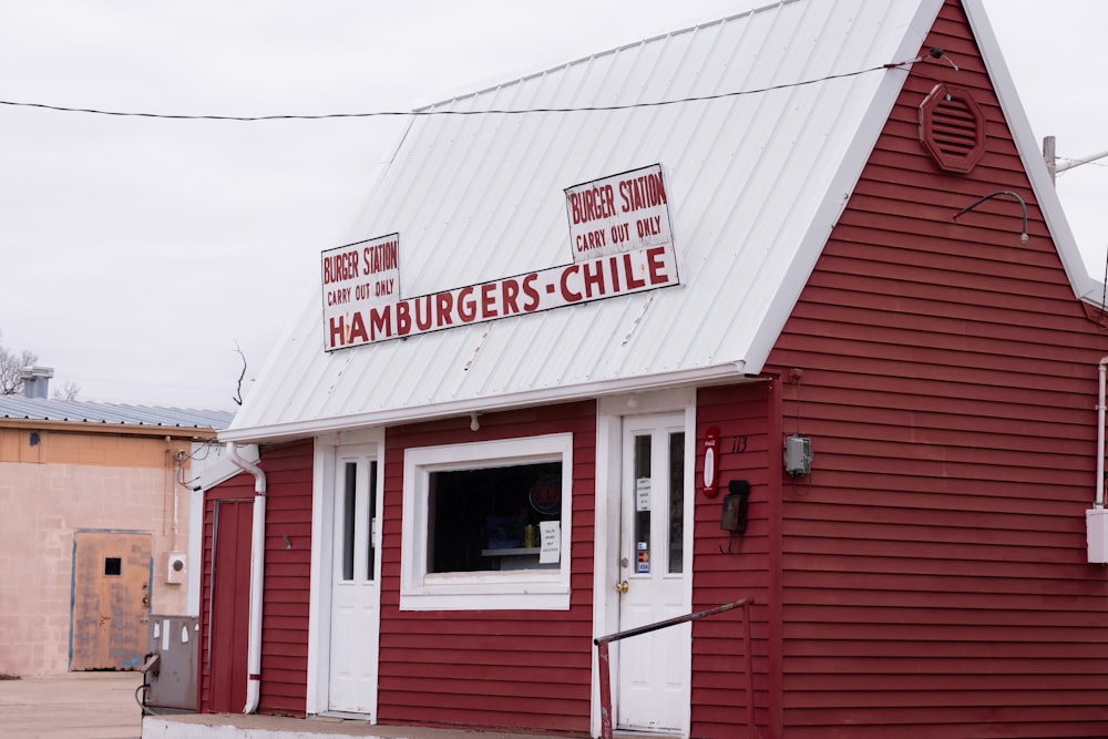 a red and white building with a sign on it