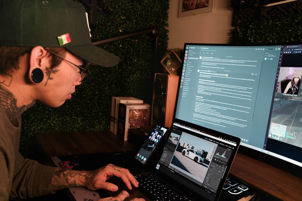 a man sitting in front of a laptop computer