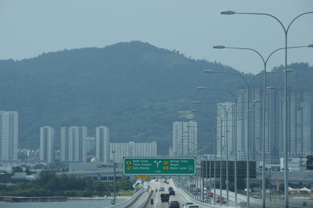 a view of a highway with a mountain in the background