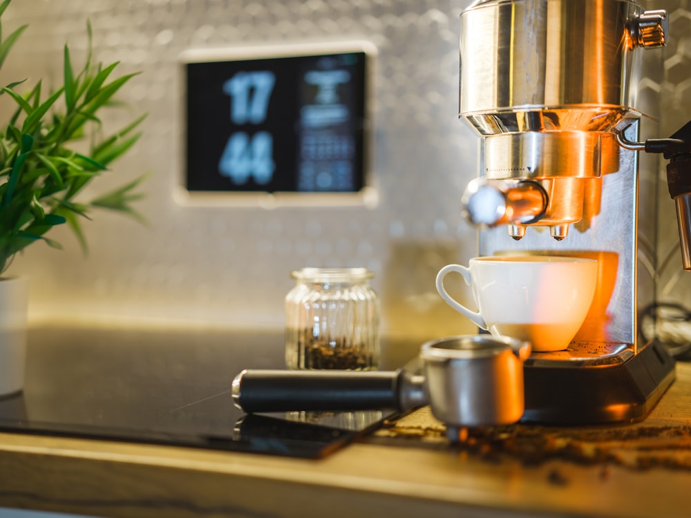 a cup of coffee sitting on top of a counter