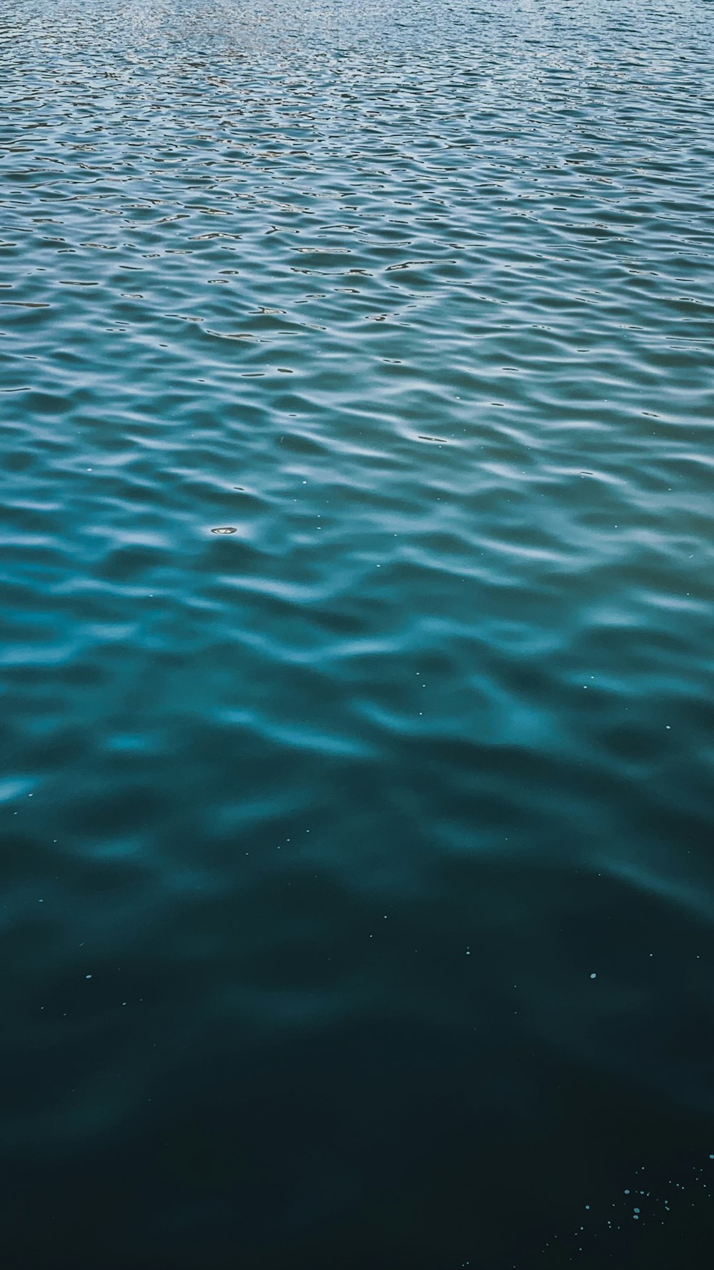 a boat floating on top of a large body of water