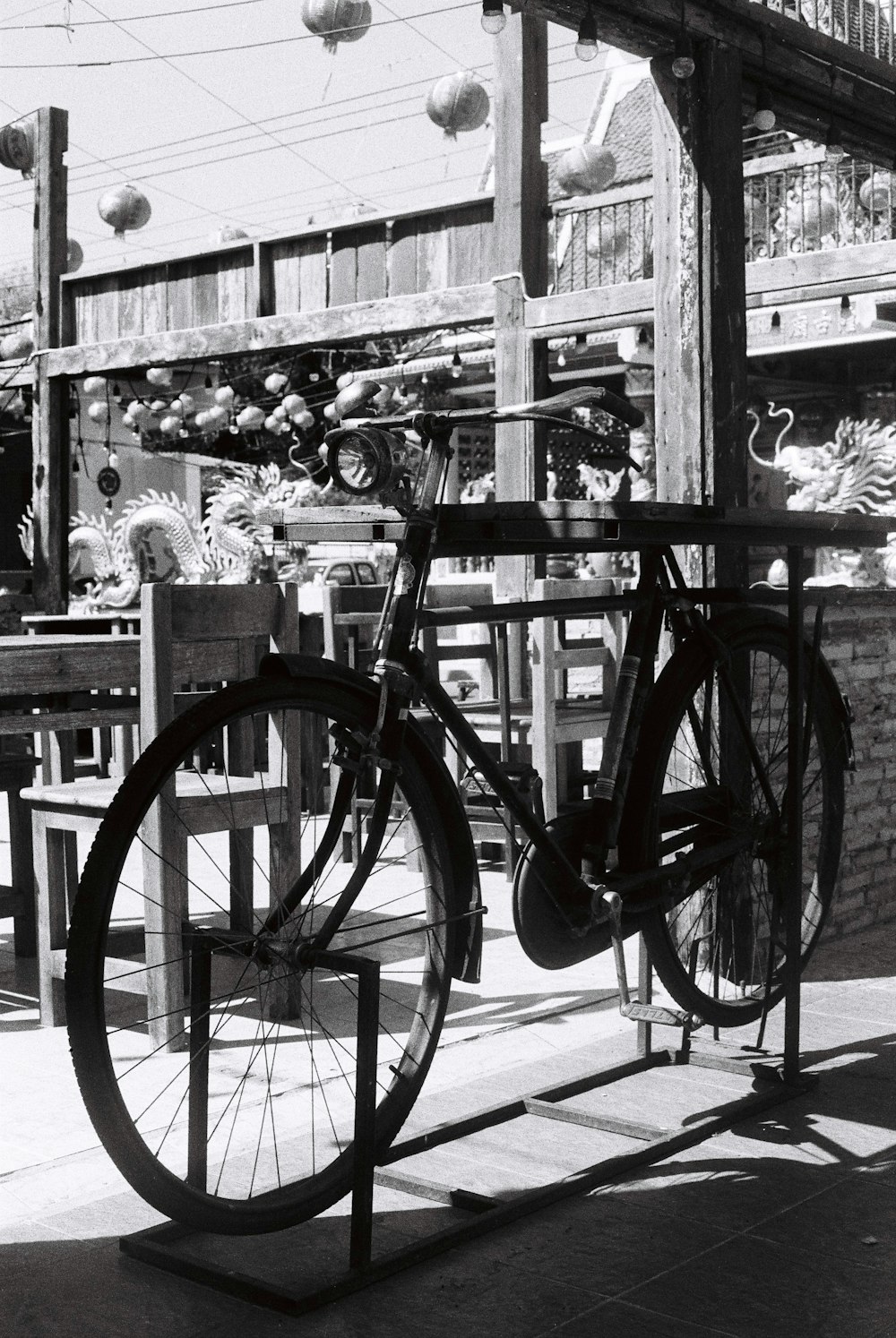 a bicycle is chained to a wooden pole