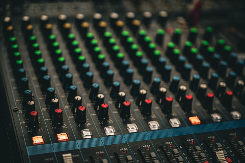 a close up of a sound mixing console