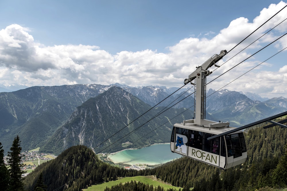 a gondola with a view of a lake and mountains