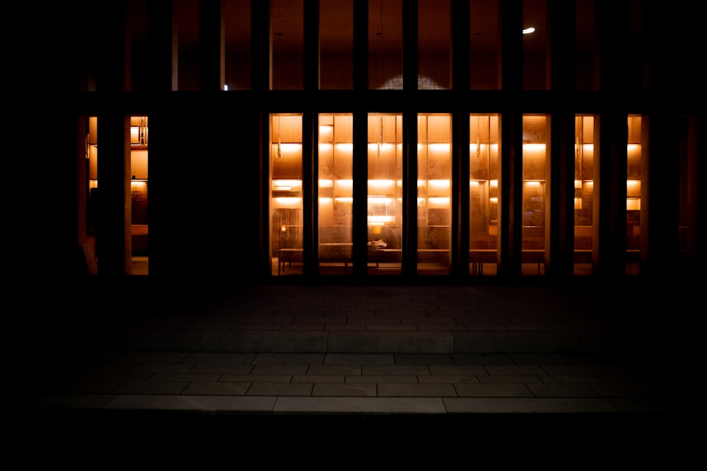 a dimly lit room with several lit up windows