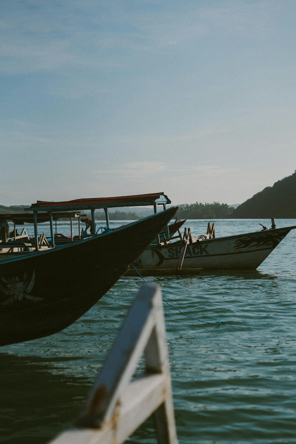 a couple of boats that are sitting in the water