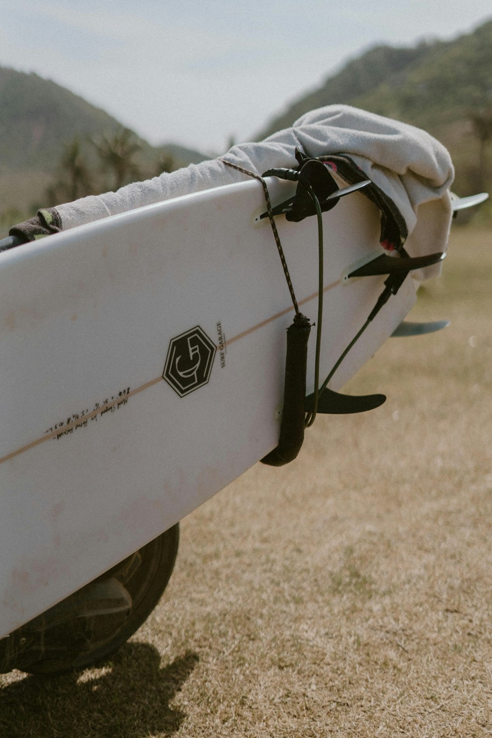 a white surfboard with a white cover on it