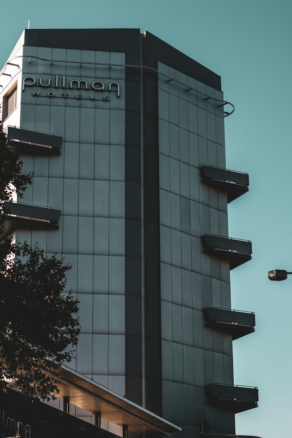 a tall building with a sign on the side of it