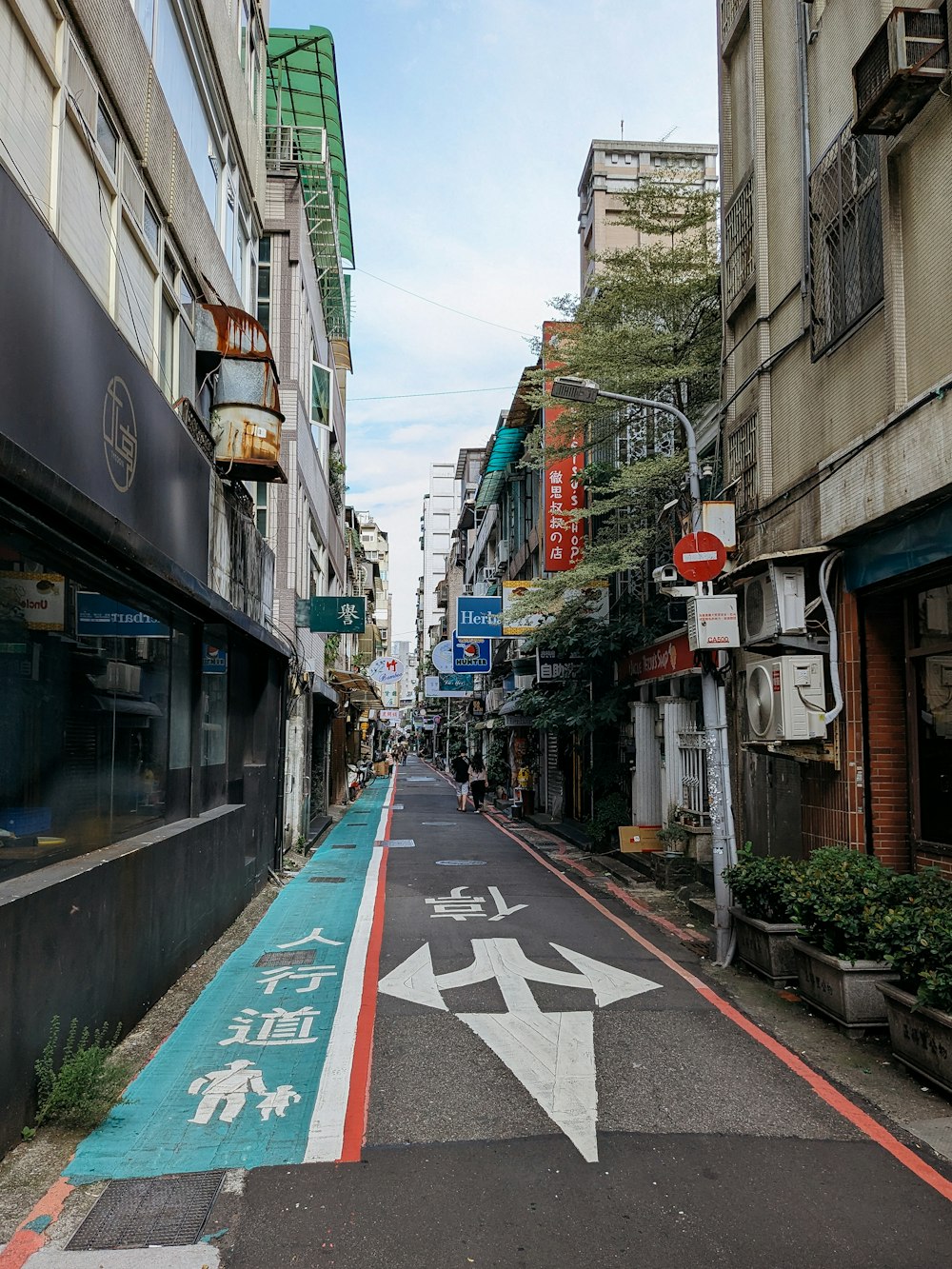 a street with a painted arrow on the side of it