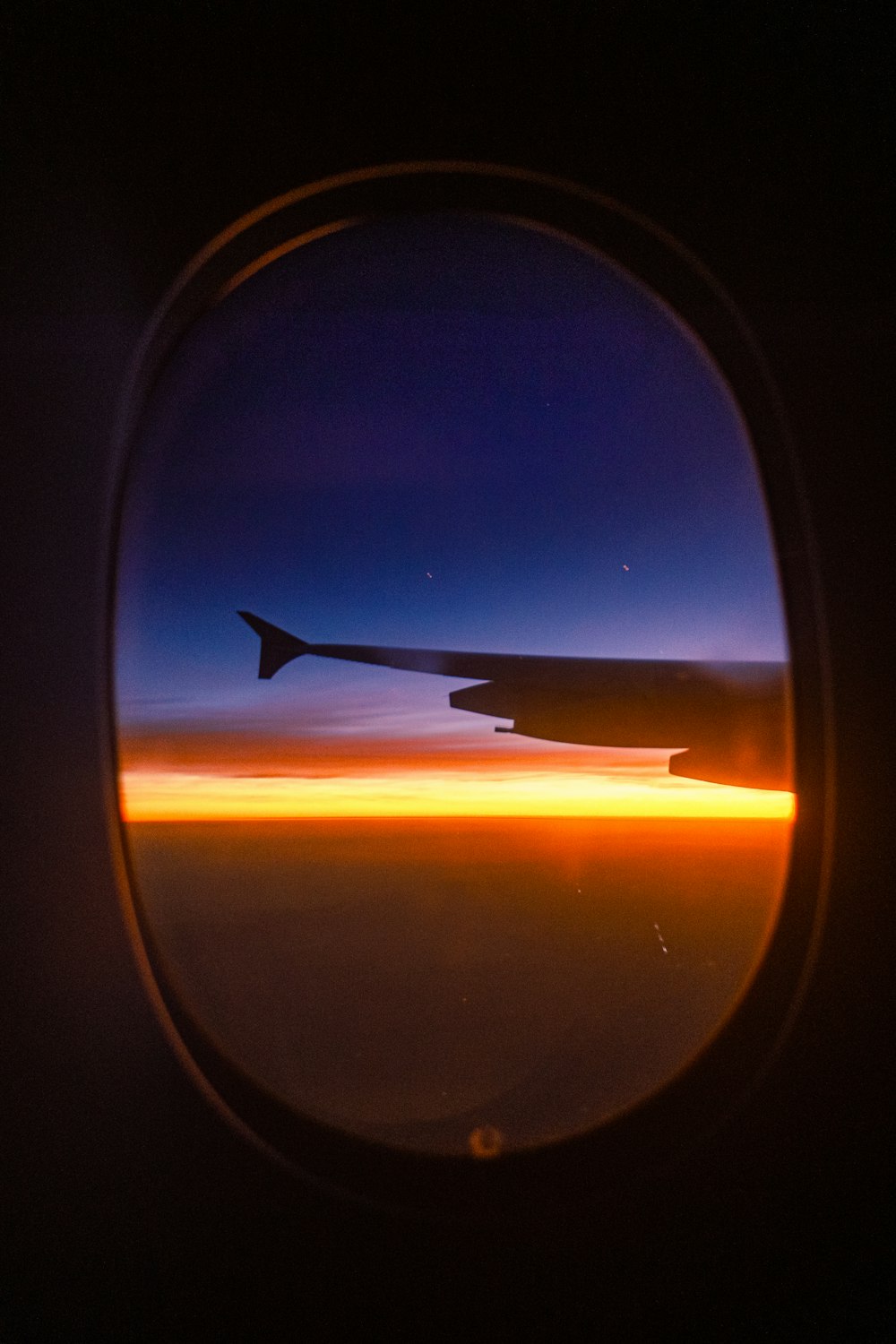 a view of the wing of an airplane at night