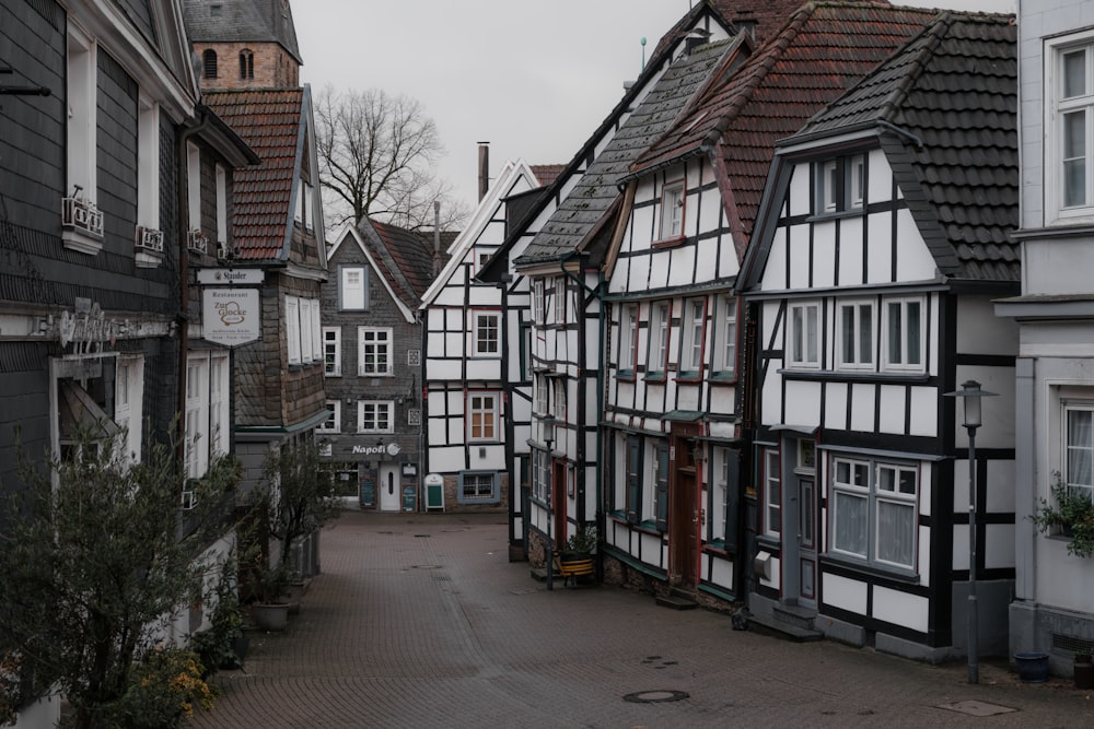 a row of old buildings on a cobblestone street