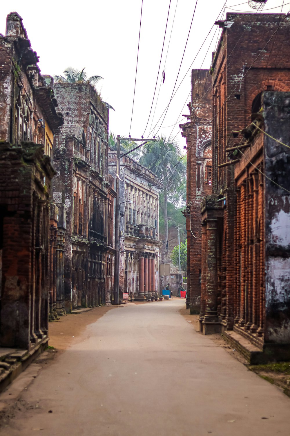 a narrow street with old buildings on both sides