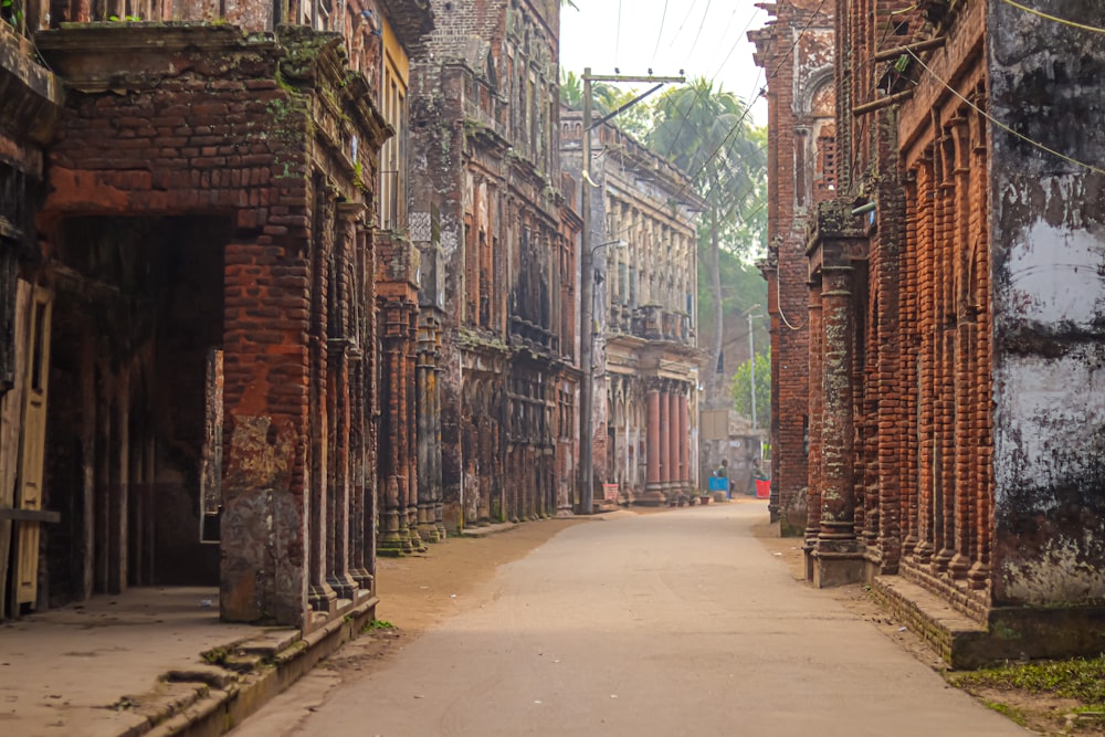 a narrow street with old buildings on both sides