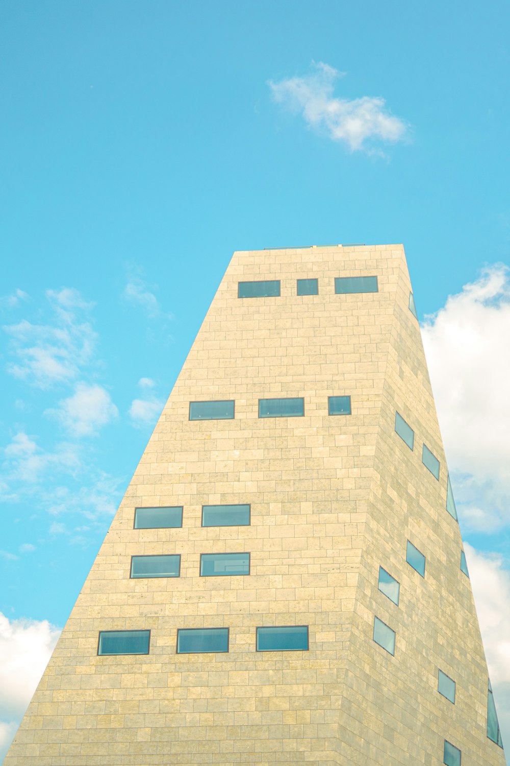 a very tall building with a clock on it's side