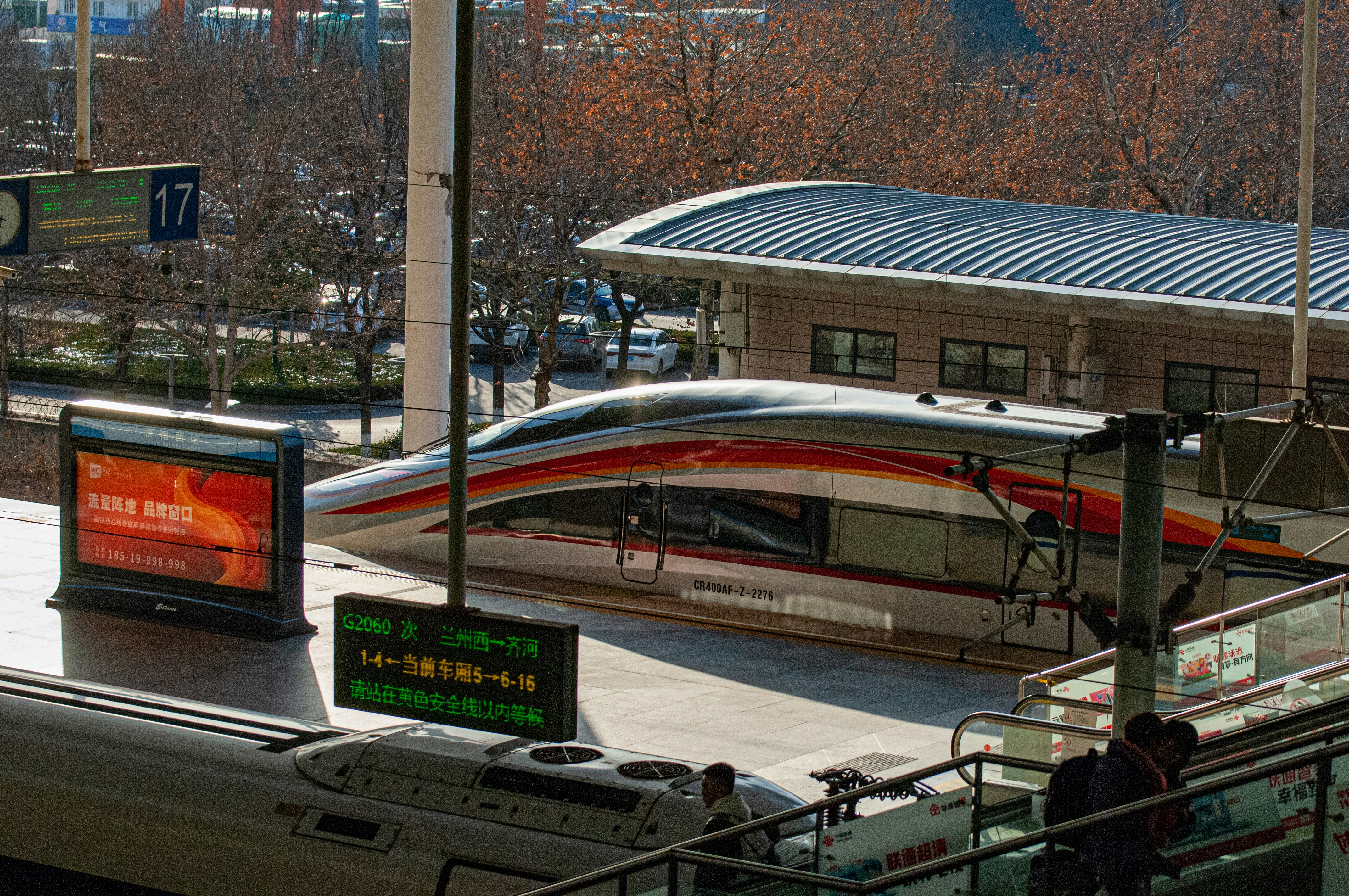 a train station with a train on the tracks