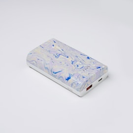 a white and blue case sitting on top of a white table