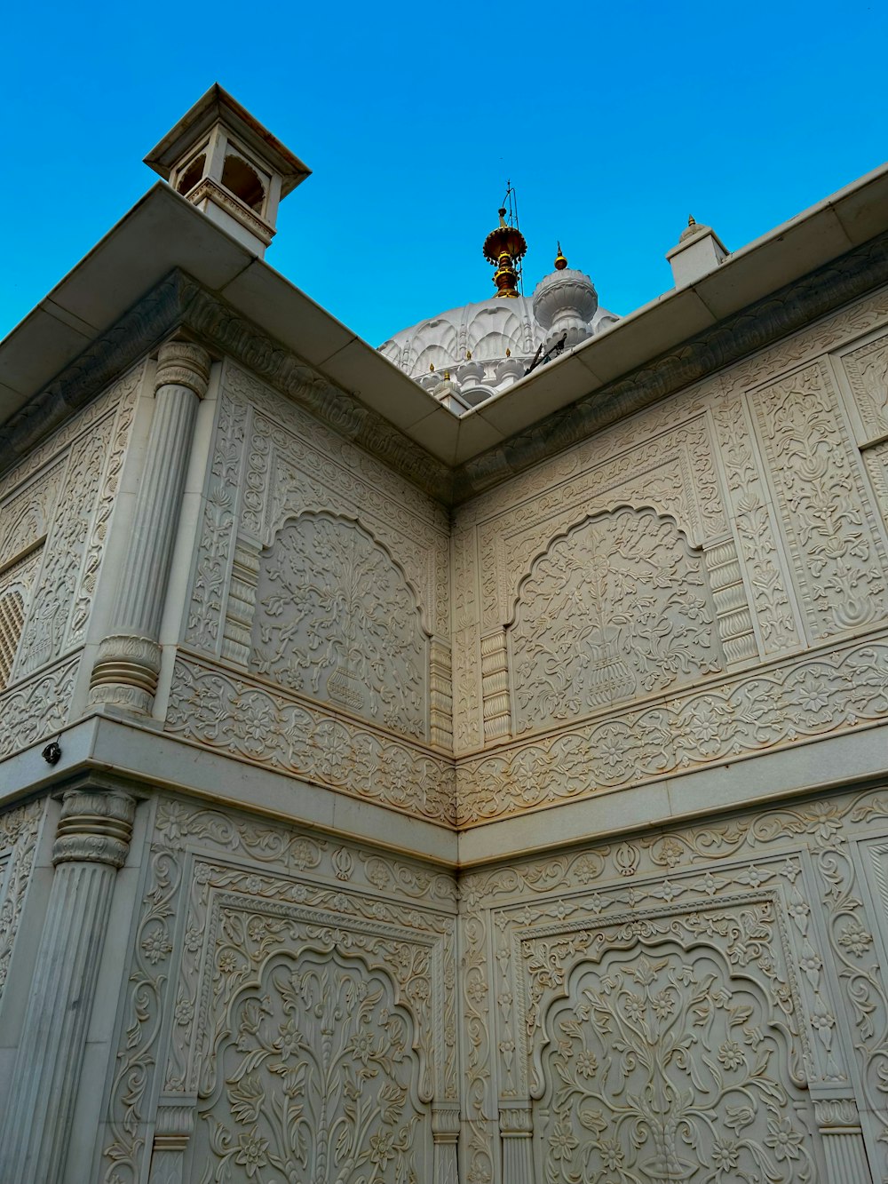 a large white building with a clock on top of it