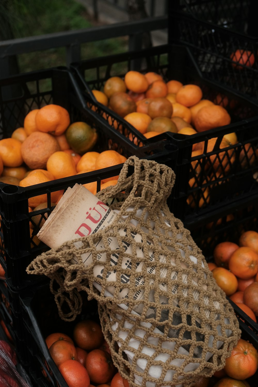 a couple of baskets filled with oranges next to each other
