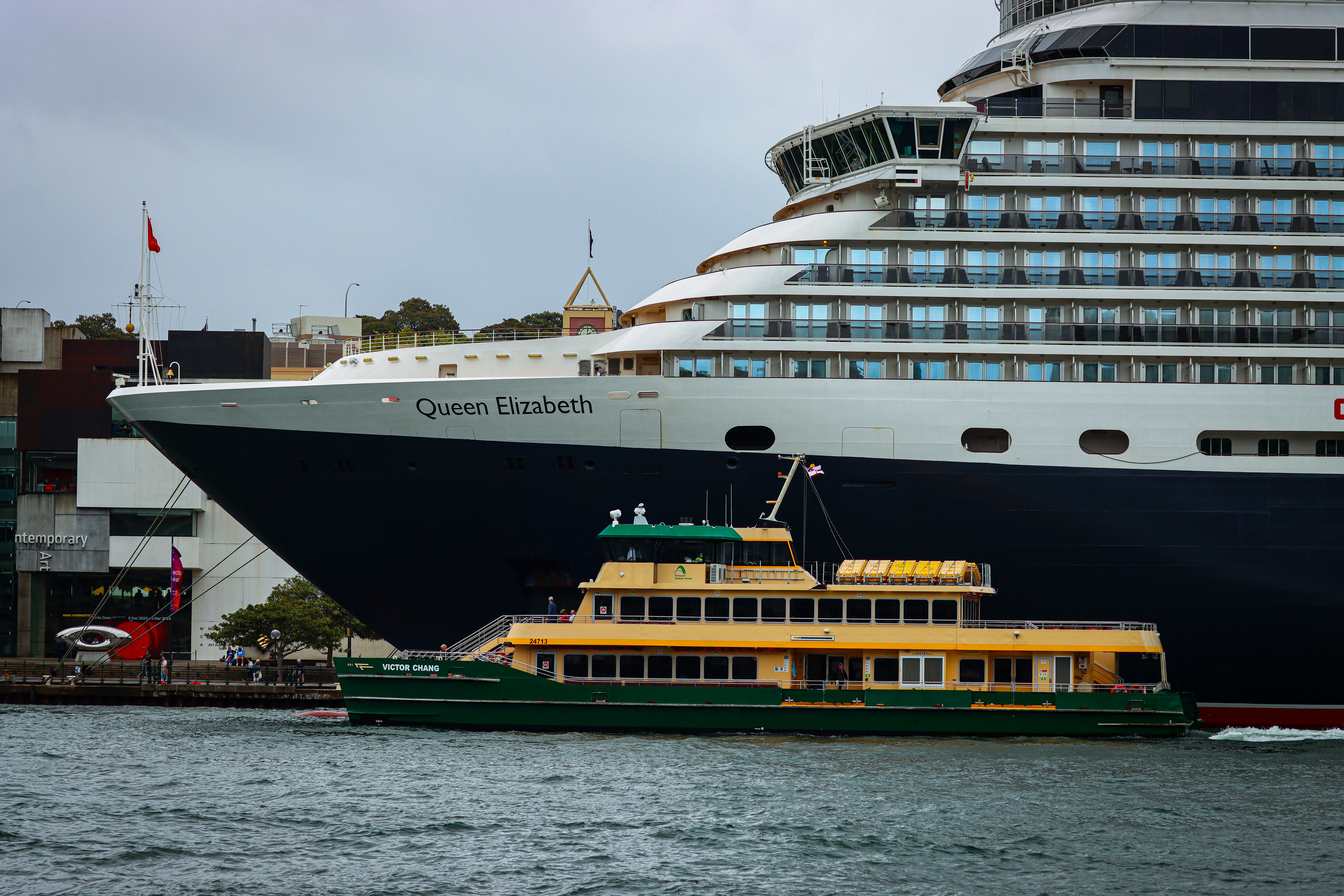 a large cruise ship in the water next to a dock