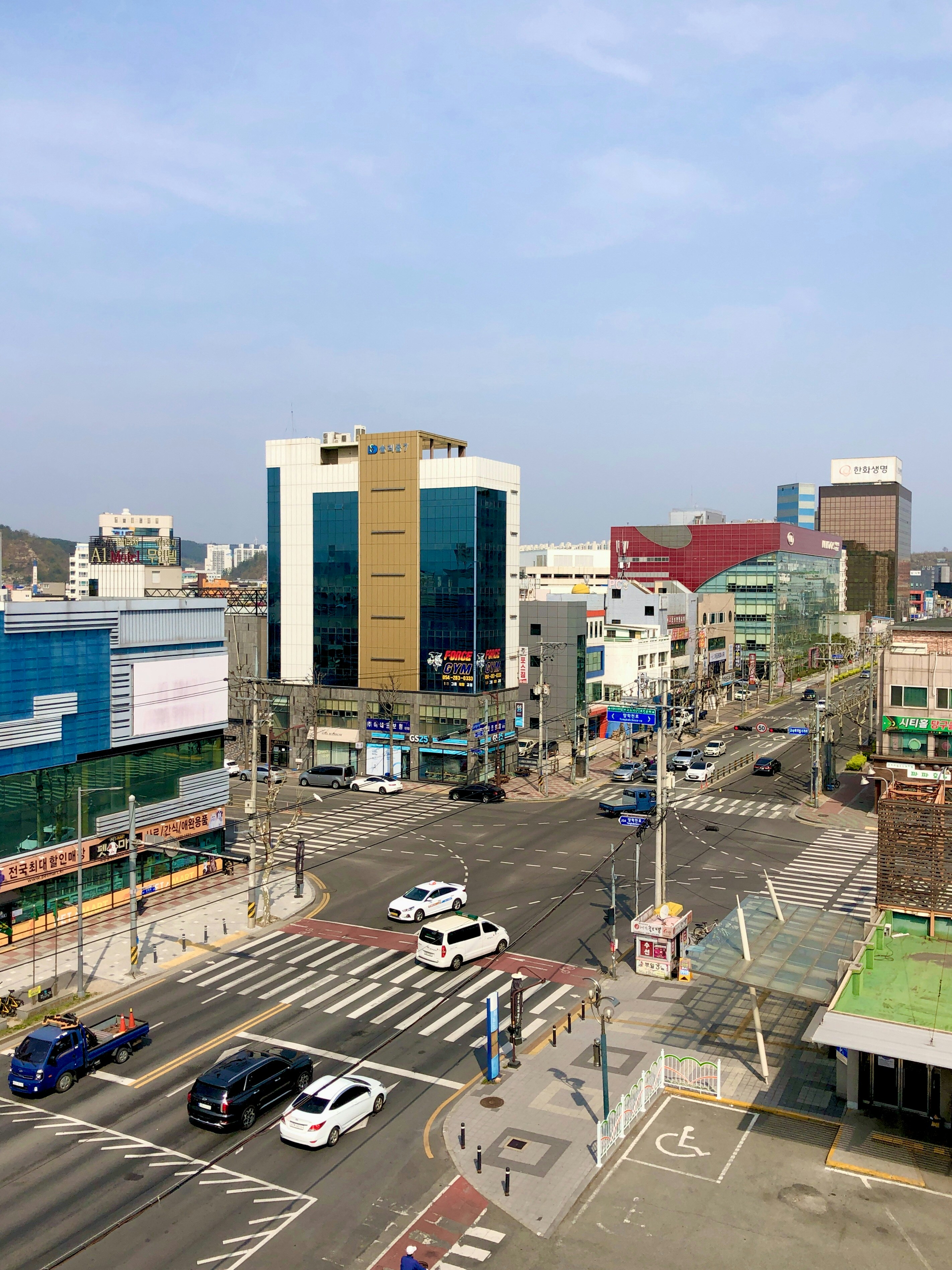 a city street with a lot of traffic and tall buildings