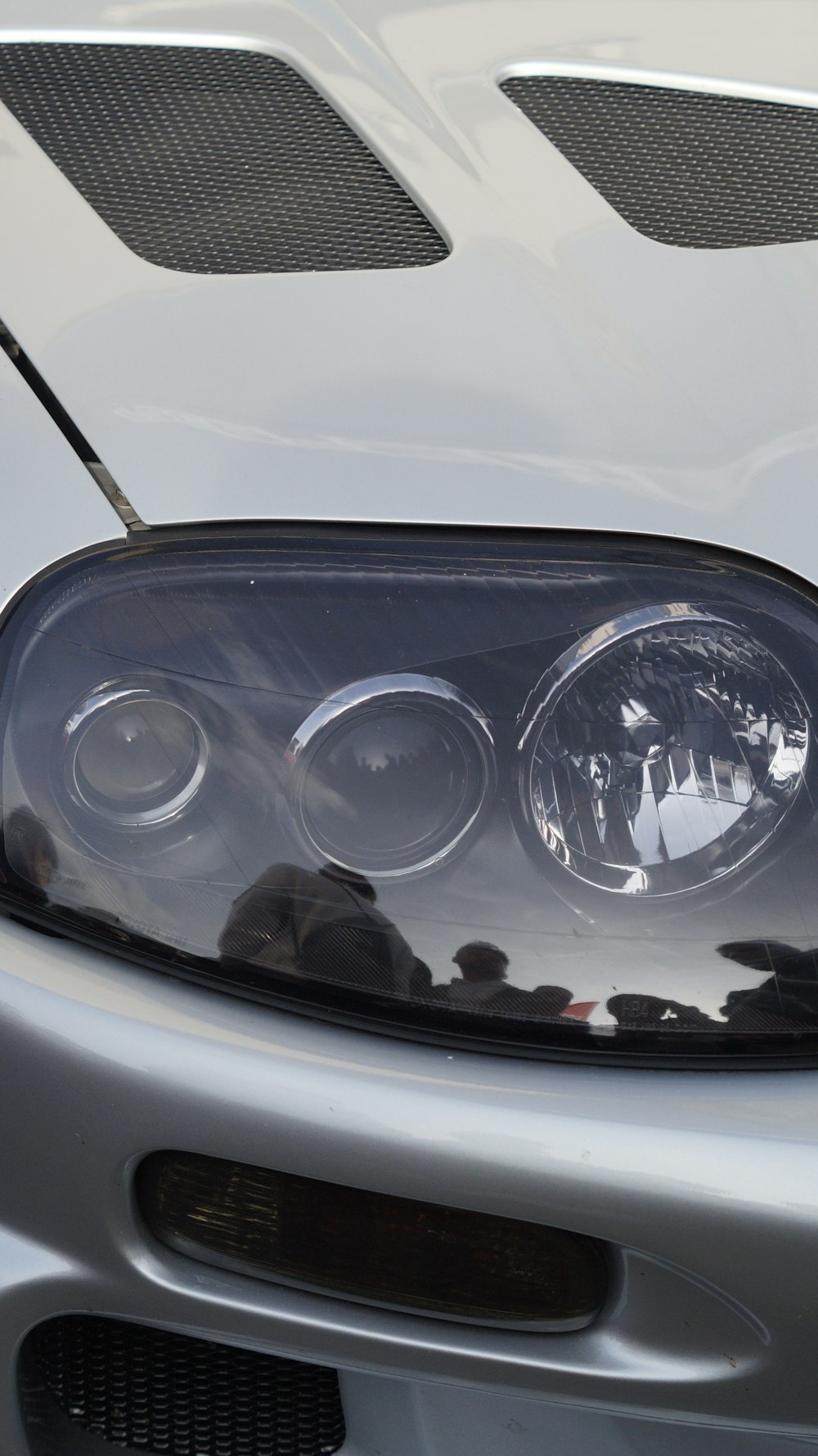 a close up of a headlight on a car