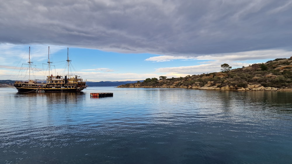 a large boat floating on top of a large body of water